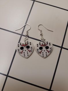 Acrylic Jason heart horror movie dangle earrings, horror killer inspired statement jewelry, alternative fashion accessory, stocking stuffer These are the perfect gift for a horror movie lover in your life! Charms are nickel free while the fishhooks are made from sterling silver so they are safer for more sensitive ears. If you would rather have clipons or leverbacks please leave it as a note to seller! Both earrings and my workspace are properly sanitized to ensure your safety during these unprecedented times. Horror Movie Jewelry, Jewelry Alternative, Movie Lover, Sensitive Ears, Horror Movie, Stocking Stuffer, Alternative Fashion, Statement Jewelry, Clay Earrings