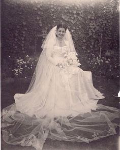 an old black and white photo of a bride