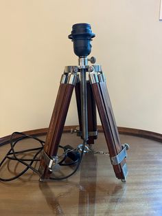 a tripod sitting on top of a wooden table