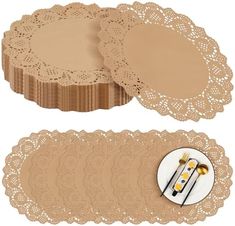 two pieces of lace doily with buttons on the side and one piece in gold