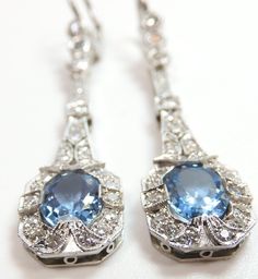 "ANTIQUE ART DECO SANTA MARIA NATURAL AQUAMARINE + DIAMOND EARRINGS {International Buyers Are Responsible For Customs & Duty Fees} Circa ~ 1930'S 2 ~ Natural Aquamarines Shape ~ Oval Color ~ Medium - Dark Blue 1 ~ 8.12 MM x 6.10 MM x 3.91 MM (1.11 Carat) 1 ~ 8.02 MM x 6.10 MM x 3.65 MM (1.07 Carat Size ~ 2.18 Carat Total Weight Country Of Origin ~ Brazil (Santa Maria Mines) 56 ~ Round Single Cut Natural Diamonds Total Weight ~ 1.10 Carat Color ~ F - G Clarity ~ VS 1 - VS 2 Overall Length - ( Blue Platinum Earrings For Wedding, Blue Elegant Earrings, Classic Blue Platinum Earrings, Luxury Antique Diamond Earrings With Accents, Antique Brilliant Cut Diamond Earrings, Antique Aquamarine Jewelry, Aquamarine Art Deco Earrings, Luxury Aquamarine Blue Earrings, Antique Diamond Engagement Rings