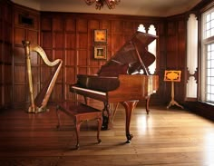 a grand piano sitting in front of a window next to a bench and a harp