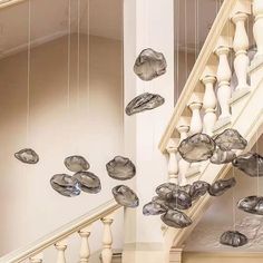 a staircase with glass balls hanging from it