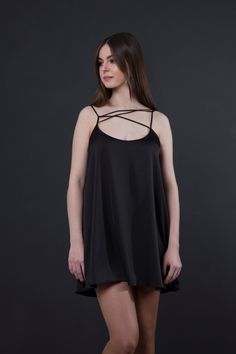 "A black slip dress featuring loose silhouette, spaghetti stapes and a mini length. - v neckline - loose silhouette - mini length - double spaghetti strapes - fully lined Color: black Fiber: 65% polyester, 30% viscose, 5% elastane. Lining: 65% polyester, 30% viscose, 5% elastane. For Size 02 US/36 EU: length - 33.5\"(85cm) Our model wears size 02 US/36 EU and is 165 cm / 5'4'' tall. MORE DRESSES: https://www.etsy.com/shop/TAVROVSKA?ref=hdr_shop_menu" Sundress Wedding Guest, Sundress Wedding, Dress Vacation, Expensive Clothes, Black Slip Dress, Mini Sundress, Satin Bags, Camisole Dress, Dress For Summer