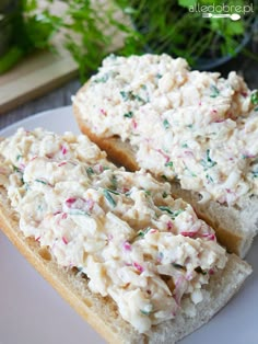 two pieces of white bread with sprinkles on them sitting on a plate