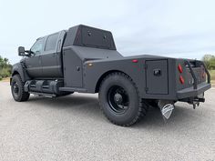 a large gray truck parked in a parking lot