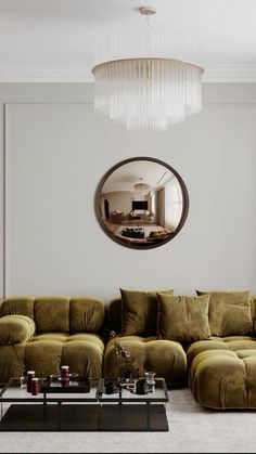 a living room filled with furniture and a round mirror