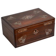 a wooden box with butterflies painted on the lid and sides, sitting on a white surface