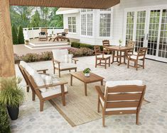 a patio with chairs and tables on it