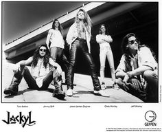 an advertisement for the band's upcoming album, lasssll is shown in this black and white photo