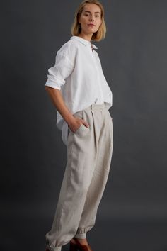 Product Details Uniform dressing receives a feminine update with our Yenna Shirt. Crafted from light and luxurious French linen with a curved hem and slim collar, the feminine silhouette is accentuated by a slight dropped shoulder and regular-width cuffs which can be rolled for a more relaxed look. The light linen is easy to tuck into a pair of pants or a flowing skirt too, allowing for added versatility in styling. If you were looking for a fresh perspective on a classic white shirt, this is it Uniform Dressing, Linen Harem Pants, Classic White Shirt, Fresh Perspective, Uniform Dress, Natural Fibre, Feminine Silhouette, Flowing Skirt, Linen Pillow Cases