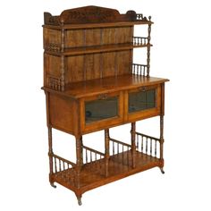 an old fashioned wooden shelf with glass doors on it's top and bottom shelves