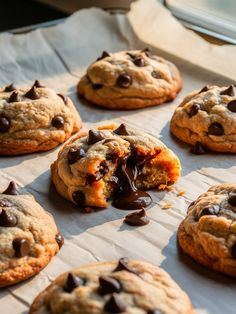 chocolate chip cookies are sitting on a baking sheet