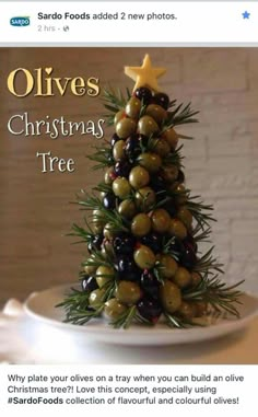 a christmas tree made out of olives on top of a plate with the words olives christmas tree