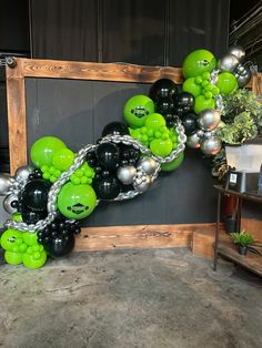 a bunch of balloons that are in the shape of a number one on a wall