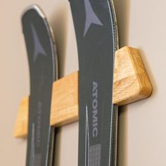 two skis mounted to the side of a wall