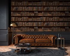 a living room filled with lots of bookshelves next to a couch and coffee table