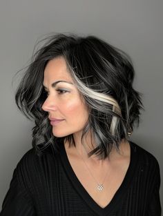 Make a statement with a sleek jet black bob featuring bold silver streaks. This modern look is great for making an impression at professional or social events. It suits all skin tones and gives a striking contrast that catches the eye. Bob Haircut Dark Hair, Haircut Dark Hair, Bob Hair Color Ideas, Fall Bob, Dark Balayage, Hair Color Ideas For Fall, Subtle Blonde Highlights, Bob Hair Color, Blonde Streaks