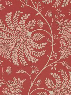 a red and gold wallpaper with leaves on it