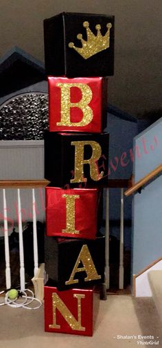 the blocks are made to look like letters with crowns on them and gold glitters