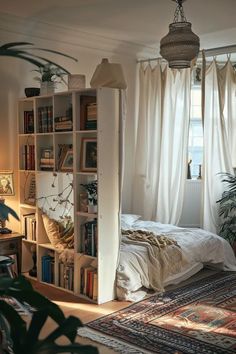 a bedroom with a bed, bookshelf and plants