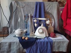 an old fashioned phone sitting on top of a table