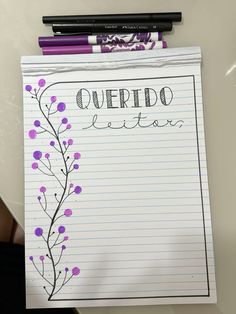 a notepad with writing on it that says queritoo written in purple flowers