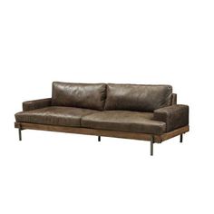 a brown leather couch sitting on top of a wooden frame