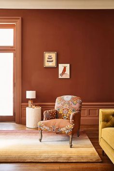 a living room filled with furniture and decor on top of a hard wood flooring