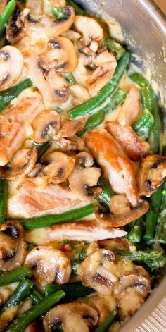 a pan filled with chicken, green beans and mushrooms