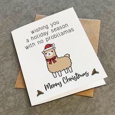 a christmas card with an image of a llama wearing a santa hat