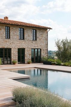 a house with a pool in front of it