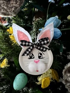 a close up of a christmas tree with an ornament on it's head