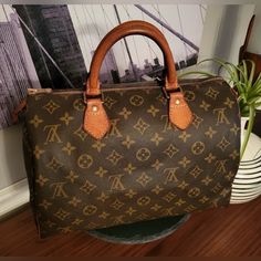 Authentic Louis Vuitton Speedy 30 Good Condition Exterior Monogram Body Is In Good Condition. I Have Taken Pictures Of Leather In Different Lighting Feel Free To Zoom For A Better View. Brass Parts Look Good And Zipper Runs Smoothly. Interior In Good Condition. -Date Code Sd0964 -Made In France -Includes Free Brown Organizer Speedy 35 Bandouliere, Lv Speedy Bandouliere 30, Speedy 25 Bandouliere, Speedy 25 Damier Ebene, Lv Speedy Bandouliere 25 Damier Ebene, Taken Pictures, Louis Vuitton Speedy 30, Speedy 30, Louis Vuitton Speedy