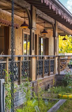 an old wooden house with wrought iron railings