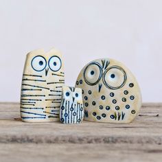 two ceramic owls sitting next to each other