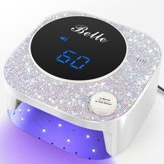 PRICES MAY VARY. 【Dual Light Source for Fast Curing】The Belle UV nail lamp with 36 dual light sources (365nm+405nm), which provide 360° uniform curing for every corner, ensures thorough curing and evenly curing, makes your nail art durable, this UV light for gel nails will not hurt your eyes or tan your skin 【4 Timer Setting & Smart Sensor】This nail UV lamp offers an innovative infinite knob control, a large LCD, and 4 timer options (10s, 30s, 60s, 90s), with a 90s low heat mode for optimal comf Nail Led Light, Sunuv Nail Lamp, Uv Light Nails Lamps, Nail Led Lamp, Uv Led Nail Lamp, Gel Nail Light, Uv Nail Lamp, Nail Dryer, Light Nails