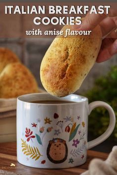 someone is dipping some bread into a coffee mug with the words italian breakfast cookies on it