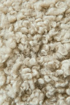 the wool is white and fluffy on top of it