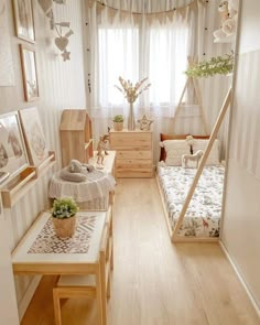 a room with two beds and some pictures on the wall above them in front of a window