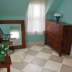 a bedroom with blue walls and white checkered flooring on the floor is shown