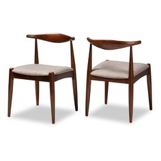 a pair of chairs with wooden frames and fabric upholstered seat cushions on each side