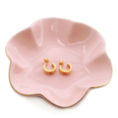 PRICES MAY VARY. The ring holder is made of quality ceramic, sturdy and durable, not easy to tip over or slide off Beautiful and unique ruffled edge with gold trim is cute and elegant, that make the ceramic tray match well with your countertop. Versatile ceramic tray, perfect for all kind of small items, like rings, earrings, necklace, keys, clips, etc. The round small jewelry dish measures 4.7 inch, it can keep your jewelries keep in place, and will not take up much space of your countertop. A Jewelry Trays Ceramic, Clay Necklace Tray, Jelewery Plate, Ceramic Jewellery Plates, Ceramic Ring Dish Heart, Clay Jewellery Plates, Abstract Jewelry Dish, Pink Trinket Dish, Key Holder Bowl