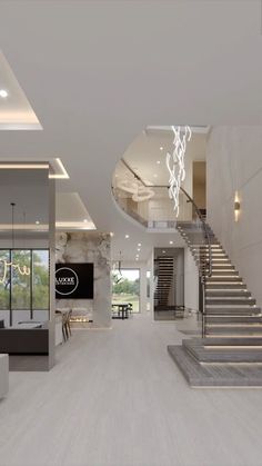 a large living room with white walls and stairs