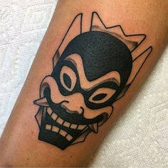 a person with a mask on their arm