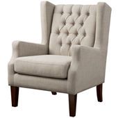 an upholstered chair with buttoned tufted back and dark wood legs, on a white background