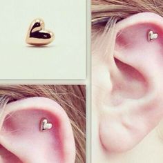 the ear has two hearts on it, and is in different stages of being pierced