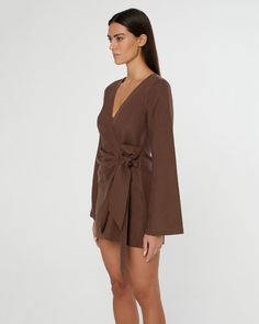 Designed in a mini crossover silhouette, this Air Linen Wrap Dress is cut from a breezy rayon-linen blend, with wide sleeves and a functional side tie. Chic Brown Linen Dress For Spring, Chic Wrap Mini Dress For Brunch, Long Sleeve Linen Mini Dress For Beach, Spring Wrap Mini Dress With Tie Waist, Surplice Neckline Mini Dress With Tie Waist For Brunch, Brunch Mini Dress With Tie Waist And Surplice Neckline, Chic Brown Linen Dress, Fall Wrap Dress With Tie Waist For Brunch, Chic Linen Wrap Dress With Tie Waist