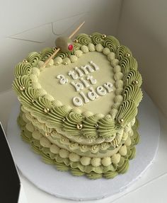 a heart shaped cake sitting on top of a table