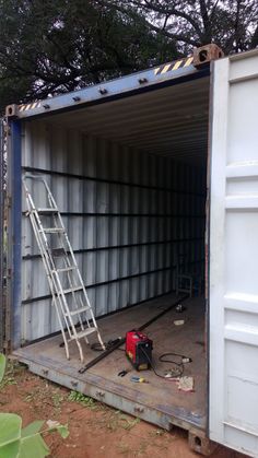 a ladder is in the back of a shipping container